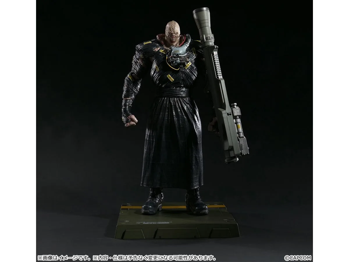 Capcom Figure Builder Creator's Model Nemesis statue with the rocket launcher arm fitted, standing on the green transport case base